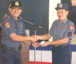 Senior Police Officer I Bolivar receives from Police Superintendent Demiar her cash prize as winner in the Police Regional Office 6 Whiz Quiz.