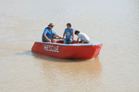 Mariano Griño (with hat) test drives his invention at the Jalaur River in Iloilo.
