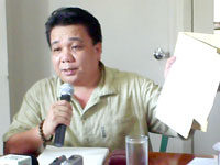 Councilor Alex Paglumotan, Chairman of the Committee on Markets and Slaughterhouse holds a copy of the list of old slaughterhouse residents who can avail financial assistance from City Government through Mayor Evelio Leonardia.