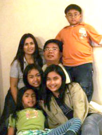 With her family.
