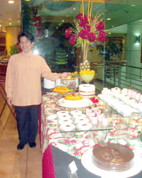Rey Ponsaran, food and beverage manager presents International Smorgasbord.