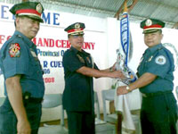 TURN OVER OF COMMAND. From outgoing Negros Occidental Provincial Police Director Senior Supt. Rosendo Franco to Senior Supt. Manuel Felix in the presence of Police Regional Office 6 director Chief Supt. Isagani Cuevas. The turn over rites was held yesterday at the NOPPO grounds.
