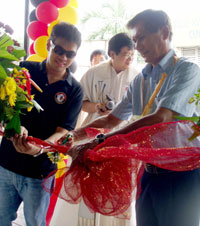 Ribbon cutting by Emmanuel Aguillon, managing director and Ambassador Roy Cimatu.