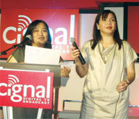 Aida Baltazar, Cignal's managing director and Annie Naval, sales and marketing for MediaQuest Holdings, Inc.